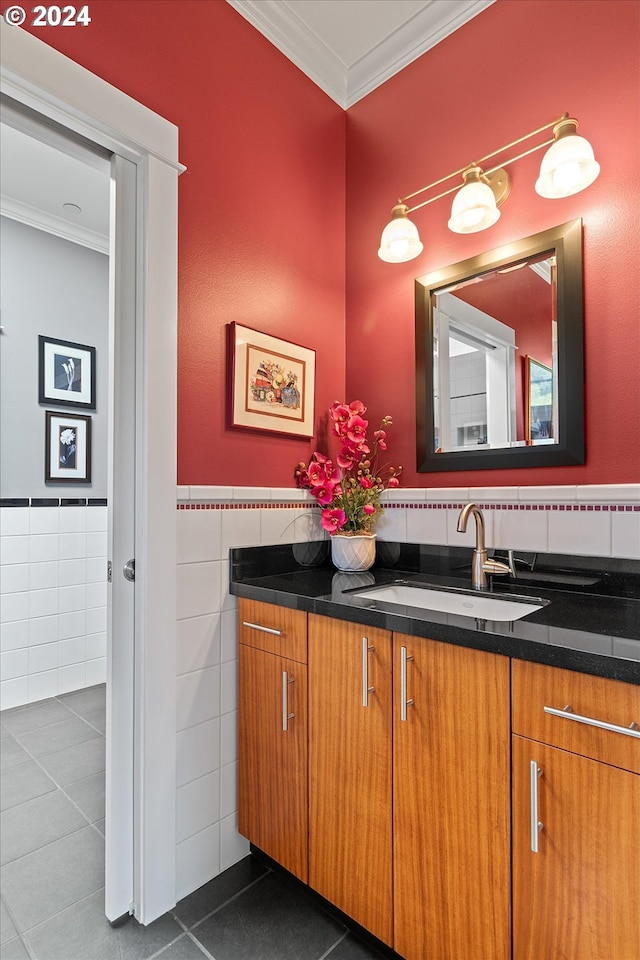 bathroom featuring crown molding, tile walls, and vanity