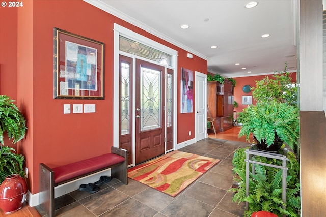 tiled foyer entrance with recessed lighting, baseboards, and crown molding