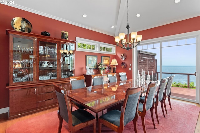 dining room featuring crown molding, a notable chandelier, and a healthy amount of sunlight