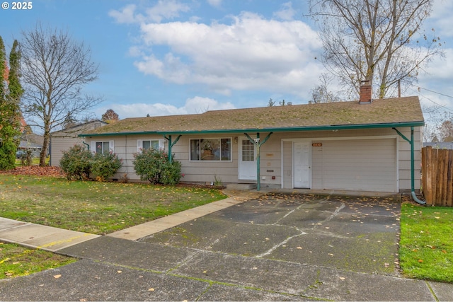 single story home featuring a front yard and a garage