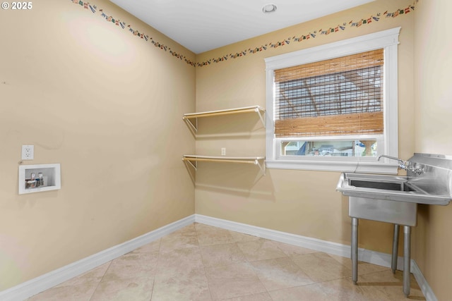 laundry room featuring light tile patterned floors and hookup for a washing machine