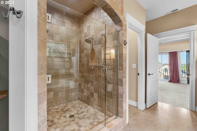 bathroom featuring tile patterned flooring and walk in shower