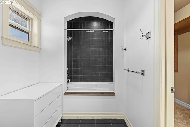 bathroom with tile patterned flooring and tiled shower / bath combo