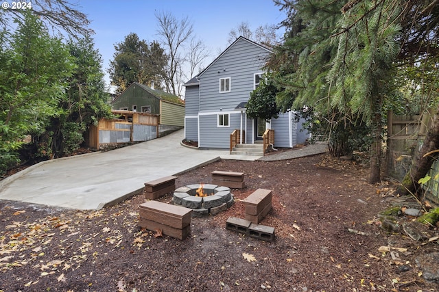 view of patio / terrace with an outdoor fire pit