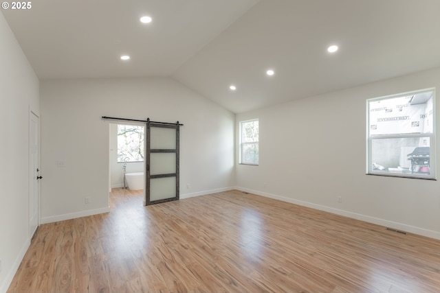 125 Sylvan Vista Ct, Roseburg, OR 97471 - unfurnished room featuring a barn door, light wood-style floors, recessed lighting, vaulted ceiling, and baseboards