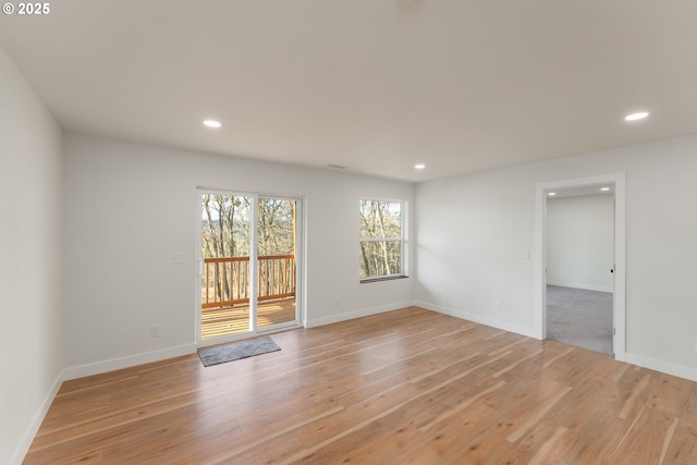 unfurnished room with light hardwood / wood-style flooring