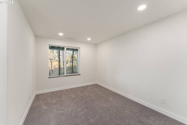 empty room featuring carpet flooring