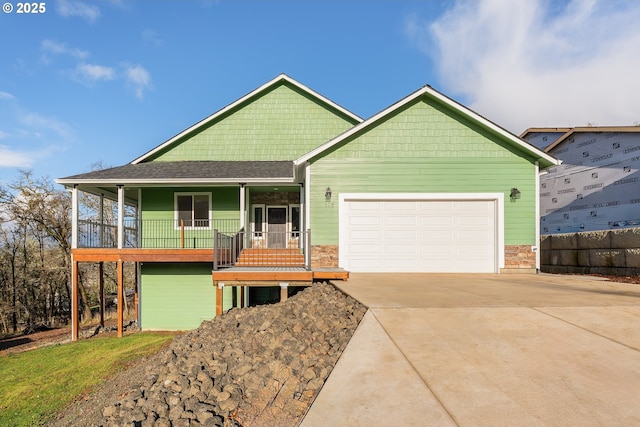 craftsman house featuring covered porch and a garage