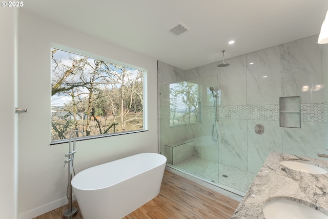 125 Sylvan Vista Ct, Roseburg, OR 97471 - full bathroom featuring a marble finish shower, wood finished floors, a freestanding tub, recessed lighting, and double vanity