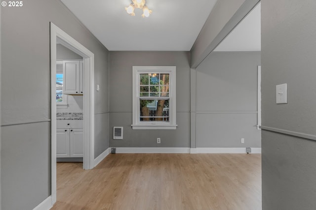 2849 Florida St, Longview, WA 98632 - unfurnished dining area with light wood finished floors and a chandelier