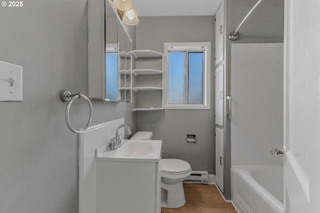 2849 Florida St, Longview, WA 98632 - full bath with a baseboard radiator, vanity, wood finished floors, and shower / bath combination