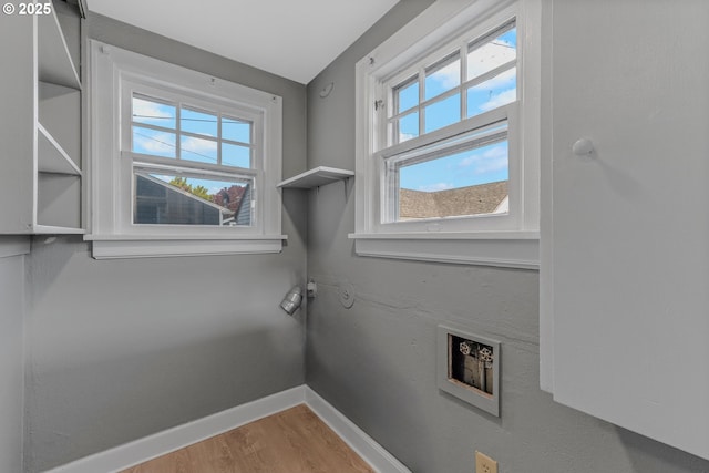 2849 Florida St, Longview, WA 98632 - washroom featuring healthy amount of natural light, wood finished floors, and hookup for a washing machine