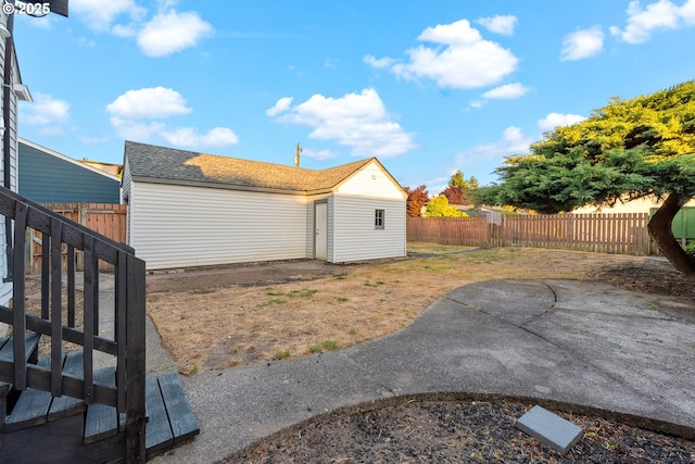 2849 Florida St, Longview, WA 98632 - back of house featuring a fenced backyard, a patio, and an outbuilding