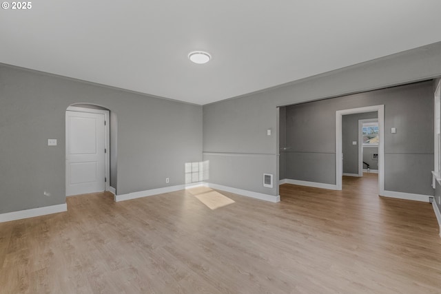 2849 Florida St, Longview, WA 98632 - spare room with arched walkways and light wood finished floors