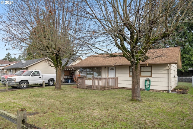 ranch-style home with a front yard