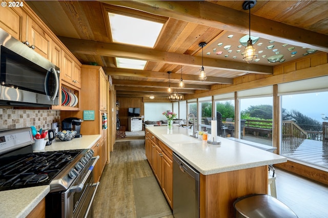 bathroom with hardwood / wood-style floors, a shower with shower door, wood ceiling, and sink