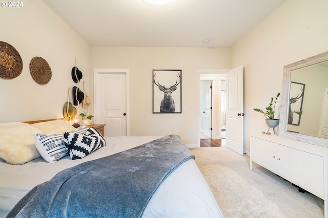 bedroom featuring light colored carpet