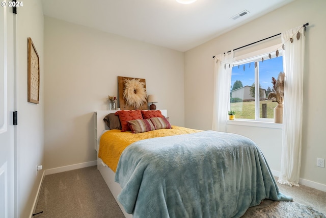 bedroom featuring carpet