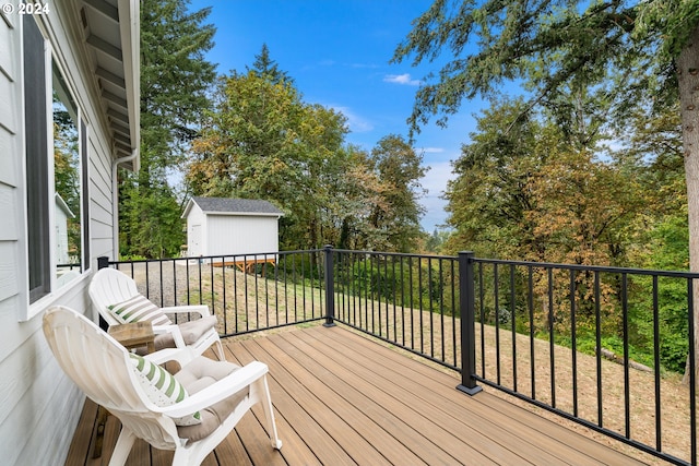 wooden deck featuring a shed