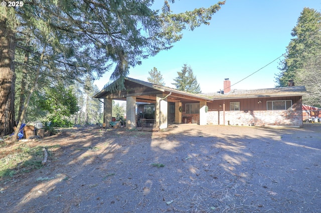 view of front of home featuring a chimney