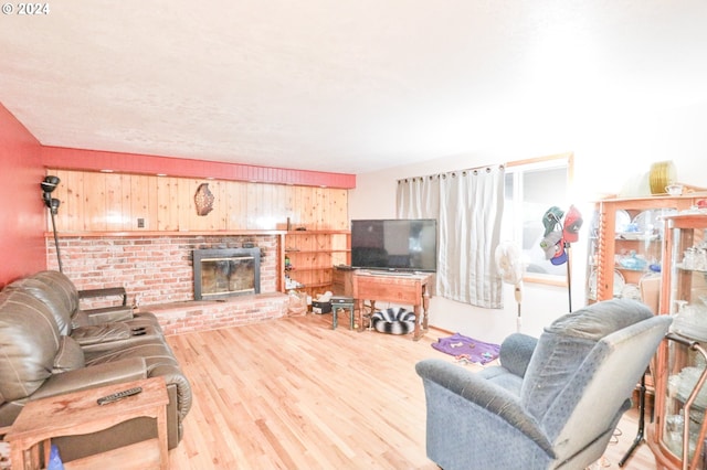 living room featuring a fireplace and light hardwood / wood-style floors