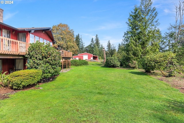 view of yard with a wooden deck