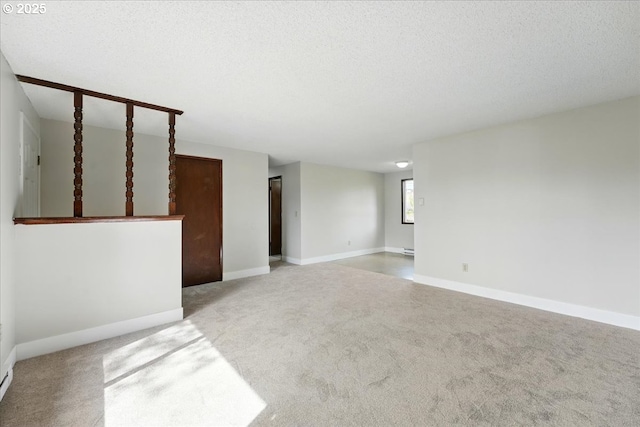 20125 SW Rachelle Ct, Beaverton, OR 97078 - empty room featuring baseboards, a textured ceiling, and carpet flooring