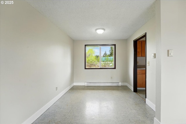 20125 SW Rachelle Ct, Beaverton, OR 97078 - unfurnished room featuring a textured ceiling, a baseboard heating unit, and baseboards