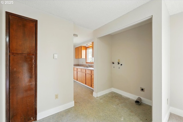 20125 SW Rachelle Ct, Beaverton, OR 97078 - washroom with hookup for an electric dryer, washer hookup, light carpet, a textured ceiling, and baseboards