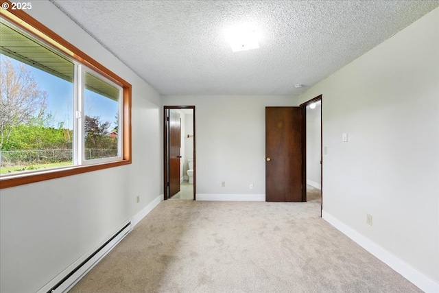 20125 SW Rachelle Ct, Beaverton, OR 97078 - unfurnished bedroom with a baseboard radiator, a textured ceiling, carpet flooring, baseboards, and ensuite bath