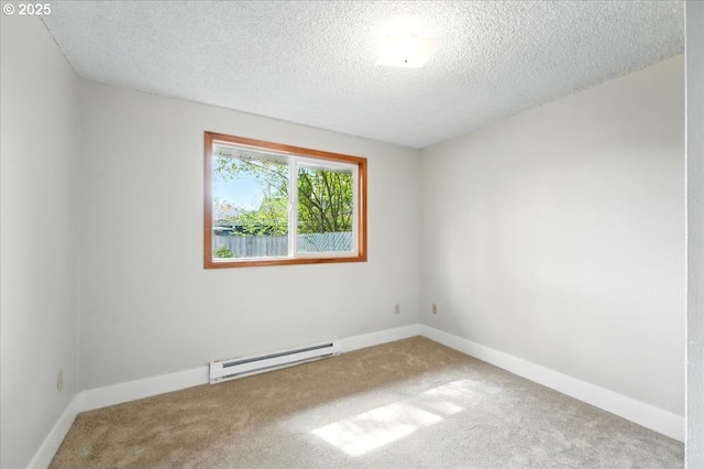 20125 SW Rachelle Ct, Beaverton, OR 97078 - carpeted empty room with baseboard heating, a textured ceiling, and baseboards