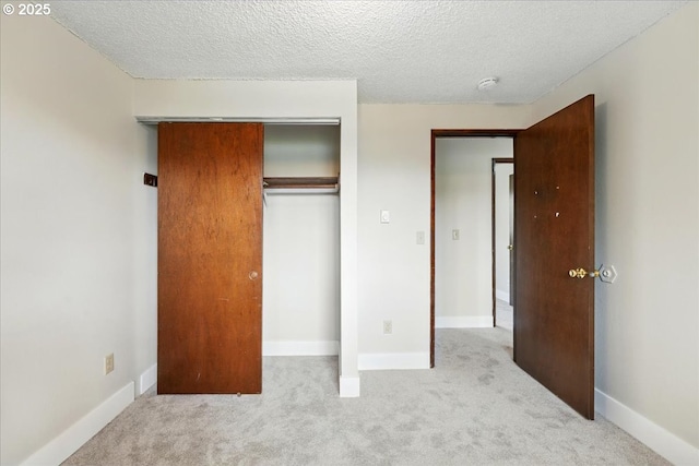 20125 SW Rachelle Ct, Beaverton, OR 97078 - unfurnished bedroom with carpet, a closet, a textured ceiling, and baseboards