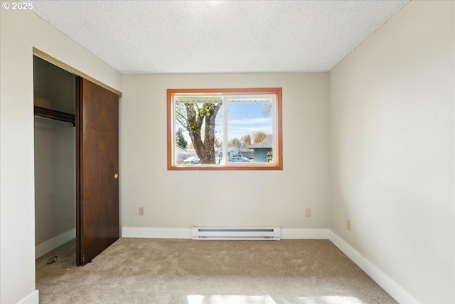 20125 SW Rachelle Ct, Beaverton, OR 97078 - unfurnished bedroom featuring baseboard heating, light colored carpet, a closet, a textured ceiling, and baseboards