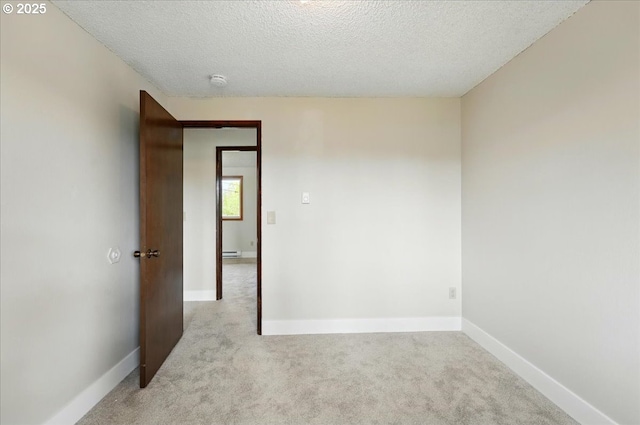 20125 SW Rachelle Ct, Beaverton, OR 97078 - unfurnished room featuring a textured ceiling, light carpet, baseboard heating, and baseboards
