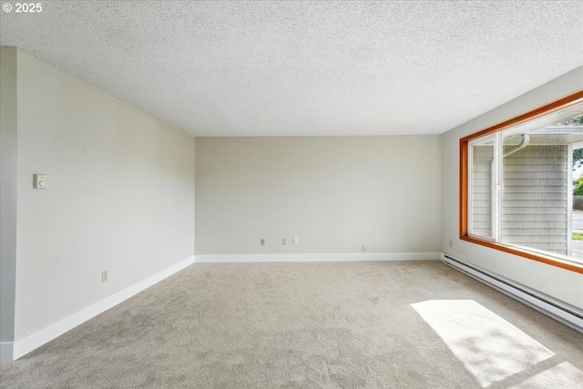 20125 SW Rachelle Ct, Beaverton, OR 97078 - carpeted empty room with baseboard heating, a textured ceiling, and baseboards
