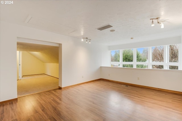 empty room with hardwood / wood-style floors