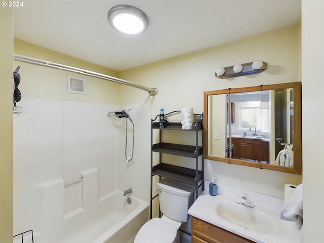 full bathroom featuring vanity,  shower combination, and toilet