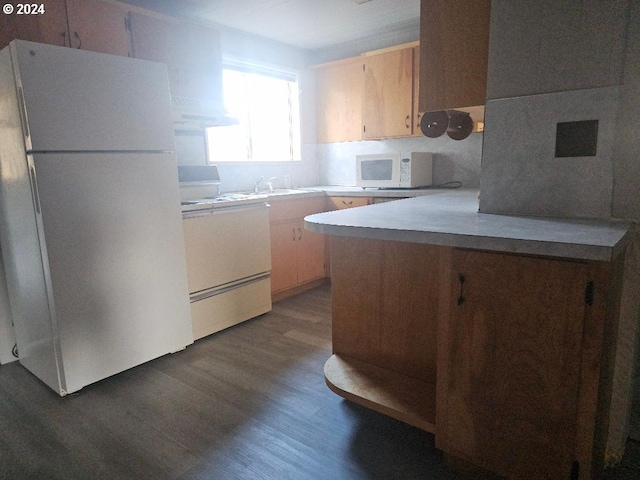 kitchen featuring sink, dark wood-type flooring, ventilation hood, white appliances, and light brown cabinetry