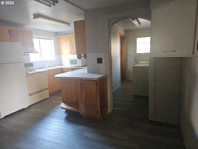 kitchen featuring white appliances, sink, light brown cabinetry, dark hardwood / wood-style flooring, and custom range hood