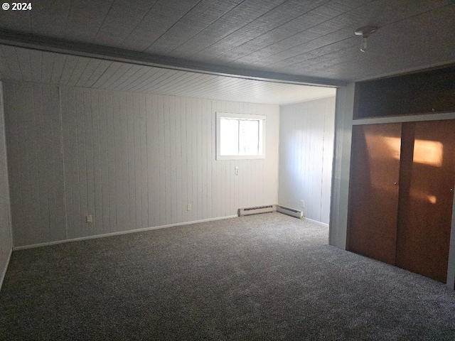 interior space featuring beam ceiling, carpet floors, and a baseboard radiator