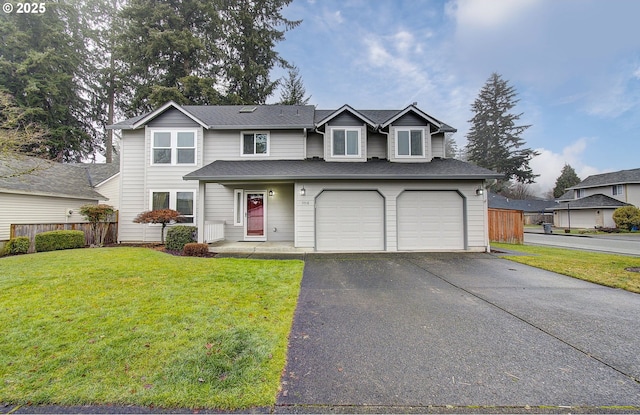 view of property featuring a garage and a front yard