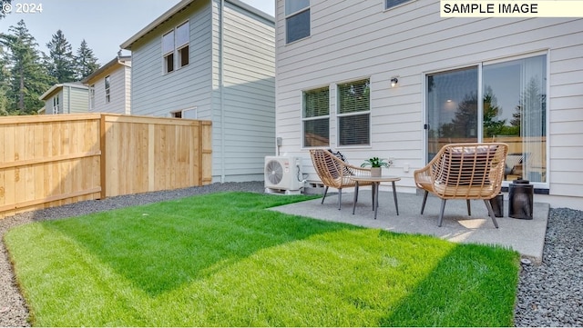 rear view of property with a patio area, a lawn, and ac unit