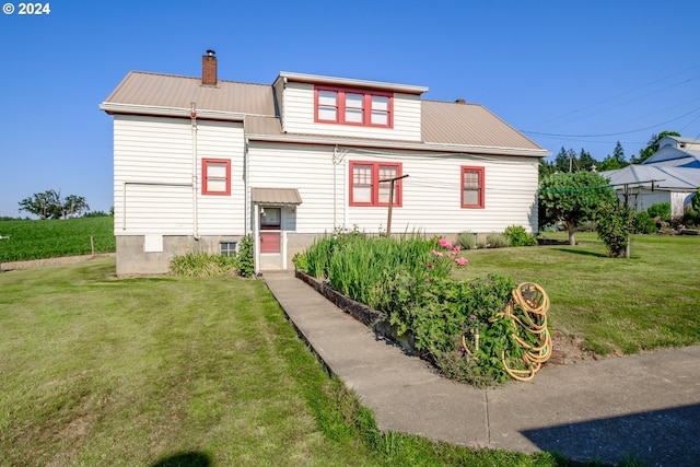 view of front of home featuring a front lawn