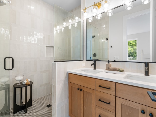 bathroom featuring vanity and an enclosed shower