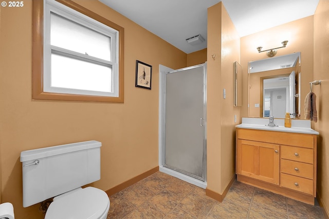 bathroom with vanity, a shower with shower door, and toilet