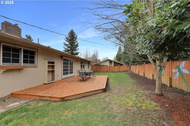 view of yard with a deck