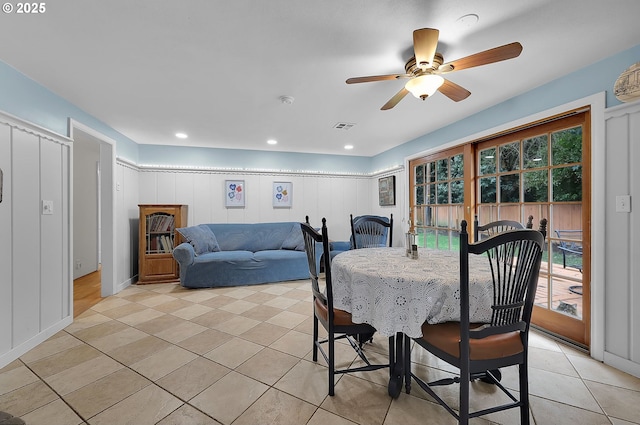 tiled dining room with ceiling fan