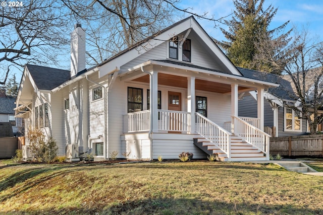 bungalow-style house with a porch and a front yard