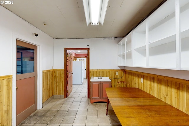 interior space featuring sink and light tile floors