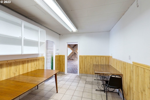 interior space featuring wood walls